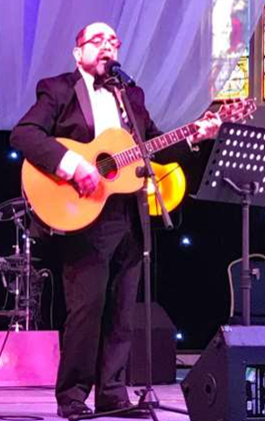 Chris playing the guitar